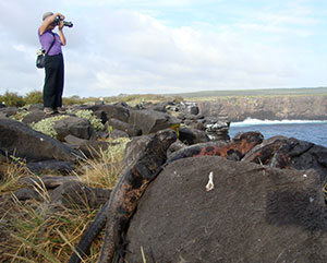 lady taking pictures in galapagos